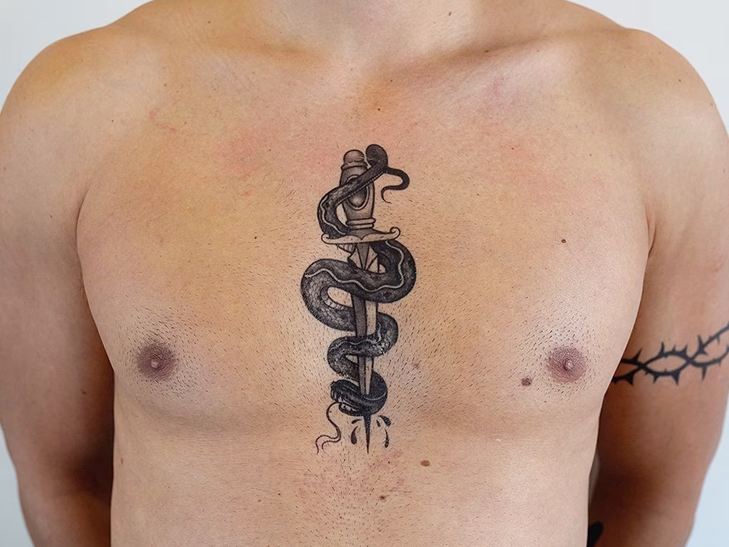 under chest tattoo